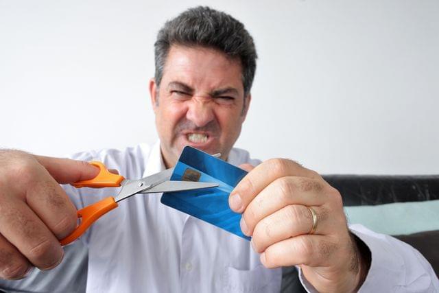 Person celebrating successful payday loan settlement and financial recovery.