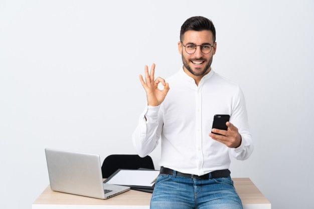Smiling person celebrating after successfully negotiating debt settlement with creditor.